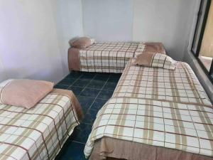 a room with two twin beds in a room at Private Holiday Home Malolo Island in Nadi