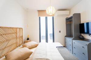 Кровать или кровати в номере Le Lodge