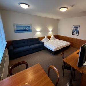 Postel nebo postele na pokoji v ubytování Hotel Höllsteiner Hof