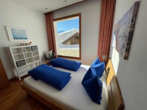 Voodi või voodid majutusasutuse Ferienwohnung Lenzerheide - Lain toas