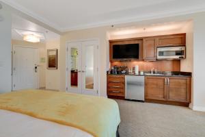 a large bedroom with a bed and a kitchen at Sin City Suite @ MGM Signature in Las Vegas