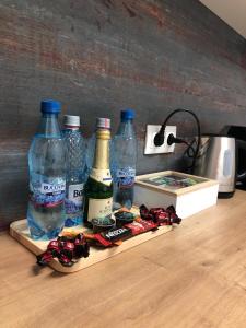 a group of bottles of water on a counter at Maya Green Residence **** in Sibiu