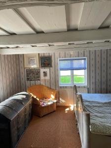 a bedroom with two bunk beds and a window at Stavsmyra in Eskilstuna