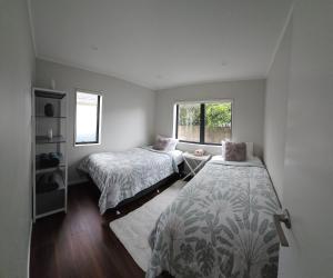Postel nebo postele na pokoji v ubytování Humble Abode