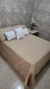 מיטה או מיטות בחדר ב-Pousada Aconchego 2