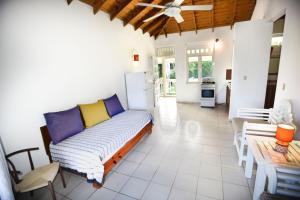 a living room with a couch and a table at El Pelicano Apart-Hotel in Las Galeras