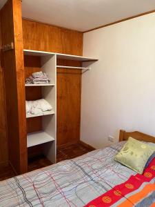 Postel nebo postele na pokoji v ubytování cabaña Wenu Mapu queule