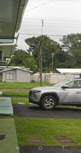 a car parked in front of a house at Villa Bonita in Tanque