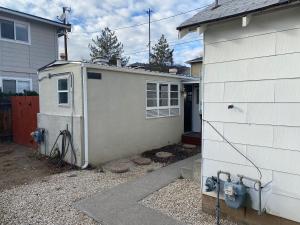 a house with a garage next to a house at Midtown Charm: 1BR Urban Pad in Reno