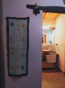a towel hanging on a wall in a kitchen at La Casa de Tilcara in Tilcara +39 photos
