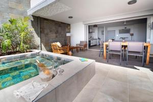 a swimming pool in the middle of a living room at LA PLAGE MARTINIQUE in Schœlcher