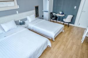 Postel nebo postele na pokoji v ubytování Mulddeule Shimpang Resort