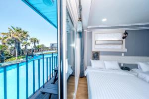 Postel nebo postele na pokoji v ubytování Mulddeule Shimpang Resort + 37 fotografií