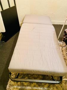 a bed frame in a room with a mattress at Chambre 1, calme, 1 station de PARIS, bureau in Maisons-Alfort