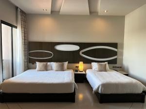 A bed or beds in a room at Sorin hotel