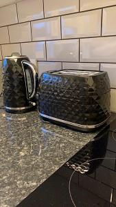a black toaster sitting on top of a counter at Southampton centre - 1 bed studio flat in Southampton