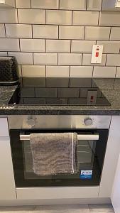 a kitchen oven with a towel hanging from it at Southampton centre - 1 bed studio flat in Southampton