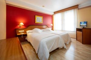 Posteľ alebo postele v izbe v ubytovaní Hotel Torrepalma
