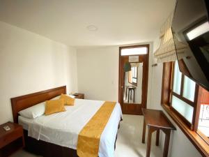 Postel nebo postele na pokoji v ubytování Hotel San Julian