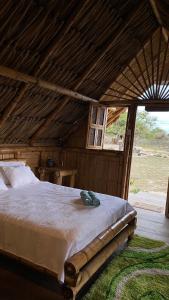 a bedroom with a large bed in a roof at Guajira Beach in Ríohacha