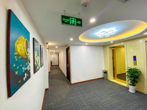 a hallway in an office with a sign on the wall at H&T Luxury Hotel in Sa Pa