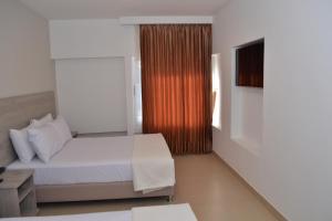 Postel nebo postele na pokoji v ubytování Hotel Zamay Plus