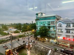 a view of a city with a bridge and buildings at Linh' house in Ho Chi Minh City
