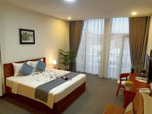 Ліжко або ліжка в номері Nimith Hotel & Restaurant