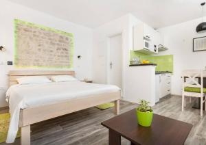 Postel nebo postele na pokoji v ubytování Apartments Mila