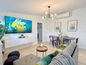 a living room with a couch and a table at Disneyland Retreat-Pool Spa Game in Anaheim