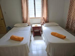 Postel nebo postele na pokoji v ubytování Jackys homestay