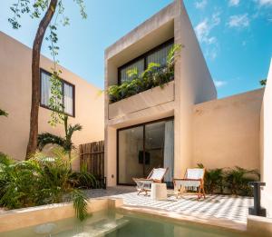Casa con piscina y casa en Collection O Faisano Boutique Luxury Hotel, Tulum Beach, en Tulum