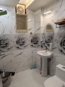a bathroom with a sink and a mirror at Rudraksha Inn in Varanasi