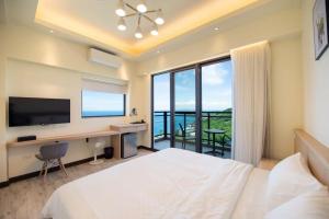 Vuode tai vuoteita majoituspaikassa 小琉球遇見海旅宿