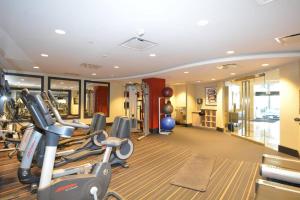 a gym with several tread machines in a room at Executive Suite at Crystal City - 1BR, Metro, Gym, Free Parking in Arlington