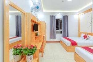 Postelja oz. postelje v sobi nastanitve Ngọc Sang 1 Hotel