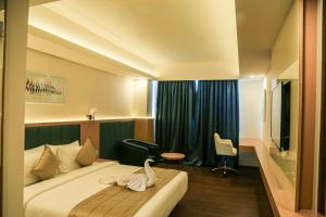Postel nebo postele na pokoji v ubytování Hotel Turmeric