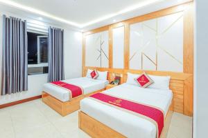 Postelja oz. postelje v sobi nastanitve Ngọc Sang 1 Hotel