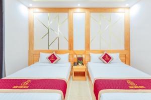 Postelja oz. postelje v sobi nastanitve Ngọc Sang 1 Hotel