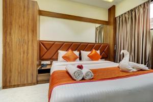 Postel nebo postele na pokoji v ubytování Hotel Archith
