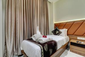 Postel nebo postele na pokoji v ubytování Hotel Archith