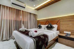 Postel nebo postele na pokoji v ubytování Hotel Archith