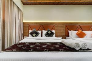 Postel nebo postele na pokoji v ubytování Hotel Archith