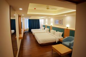 Postel nebo postele na pokoji v ubytování Hotel Turmeric