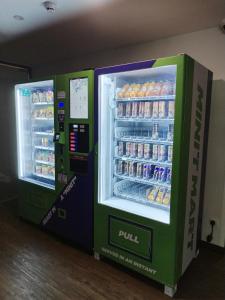 two vending machines in a store with drinks at SRITEL BOUTIQUE HOTEL in Shah Alam