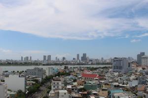 a view of a city with buildings and a river at Stay Hotel in Danang