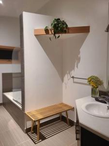 a bathroom with a sink and a shelf with a plant at Five Star-Amazing views and Hot Tub in Crescent Valley