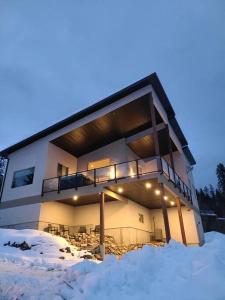 a building with snow in front of it at Five Star-Amazing views and Hot Tub in Crescent Valley