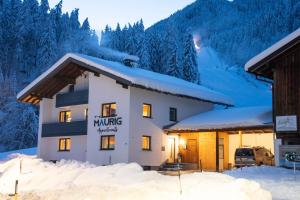 a hotel in the snow in the mountains at Maurig Appartements in Elbigenalp