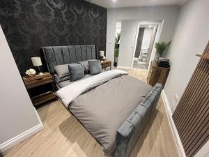 Ένα ή περισσότερα κρεβάτια σε δωμάτιο στο Westhill Road Apartment